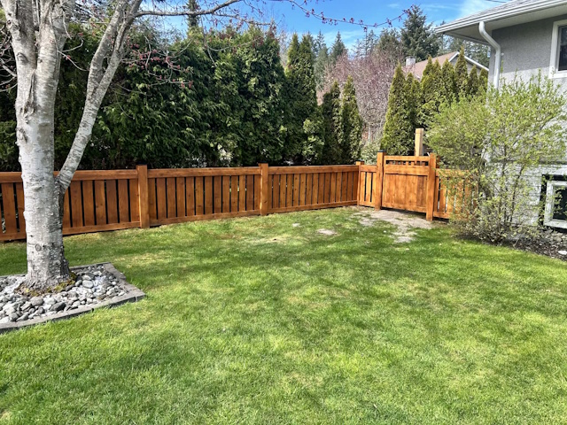 A fencing installation done by West Coast Fencing, displayed as a work sample.