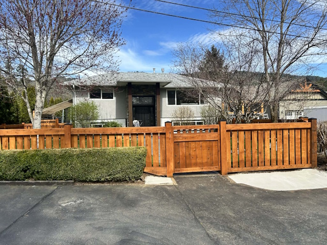 A fencing installation done by West Coast Fencing, displayed as a work sample.