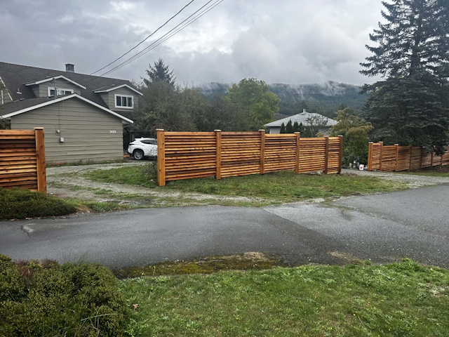 A fencing installation done by West Coast Fencing, displayed as a work sample.