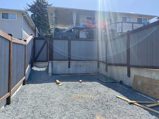 A fencing installation done by West Coast Fencing, displayed as a work sample.