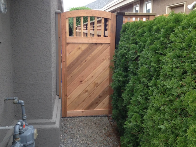 A fencing installation done by West Coast Fencing, displayed as a work sample.