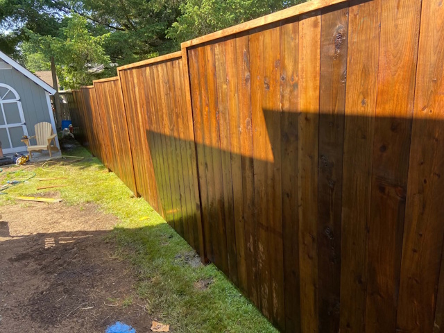 A fencing installation done by West Coast Fencing, displayed as a work sample.